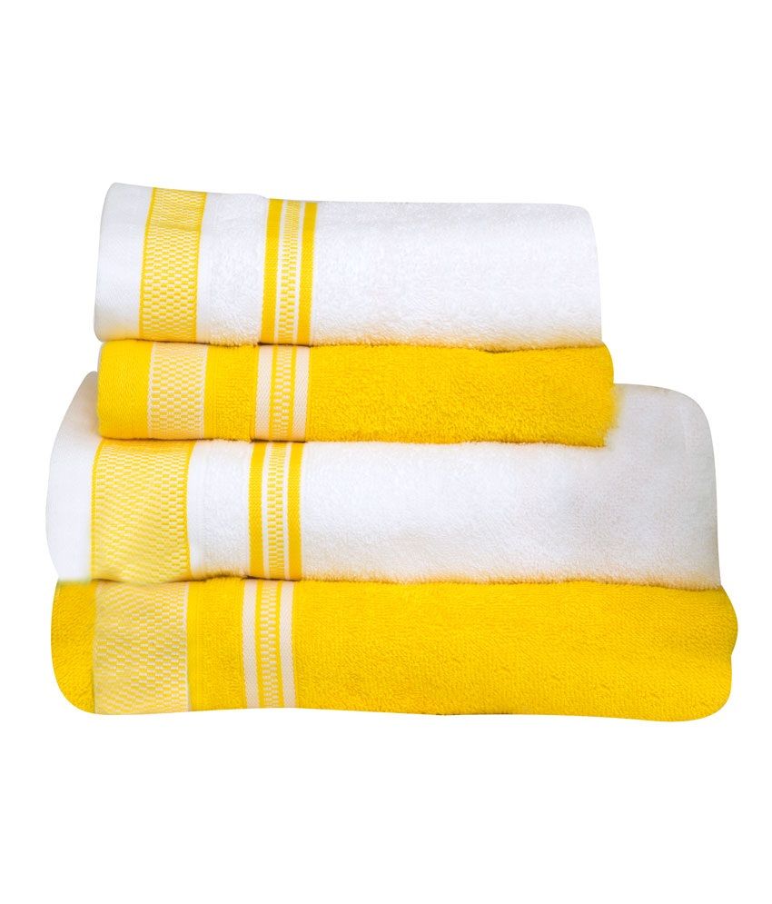 yellow and white bath towels