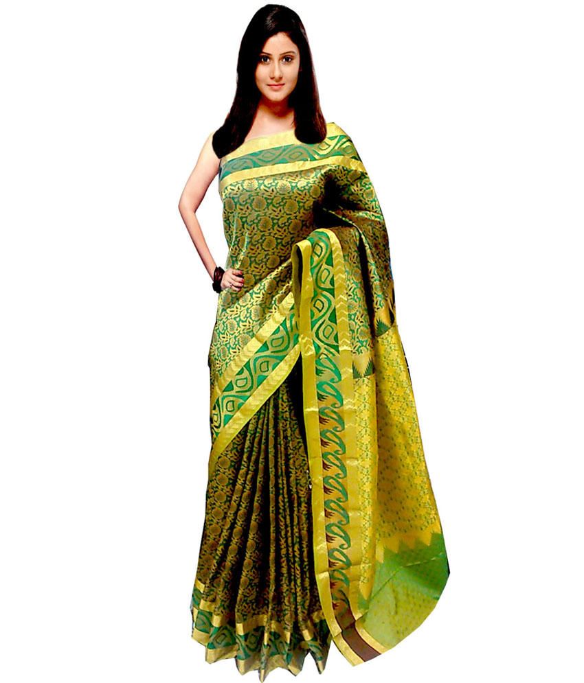 cream and green colour saree