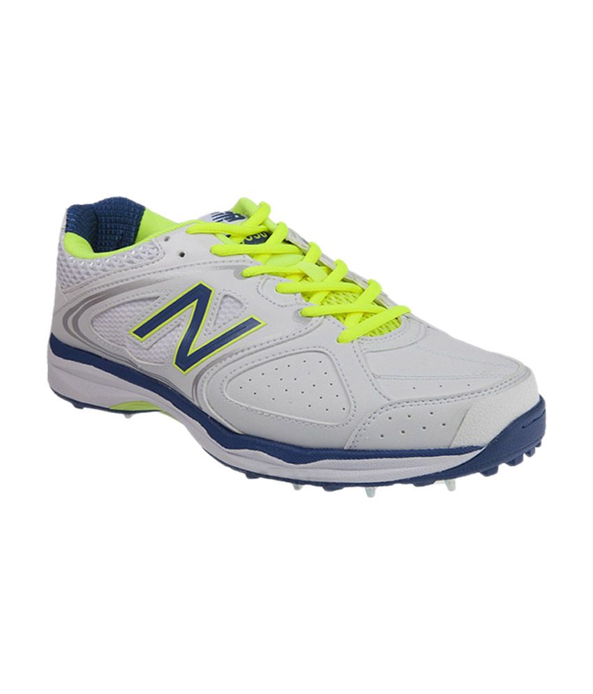 blue and yellow new balance cricket