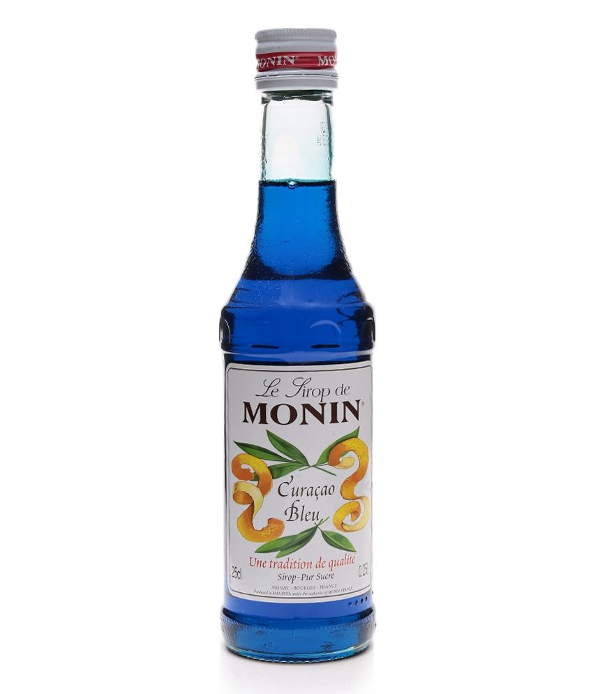 Блю кюрасао какой вкус. Monin Blue Curacao. Основа сироп голубая Лагуна белая бутылка.