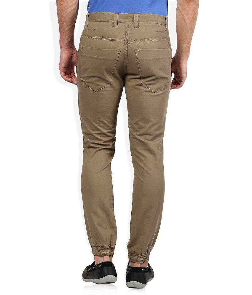 United Colors of Benetton Beige Solid Flat Front Trousers - Buy United ...