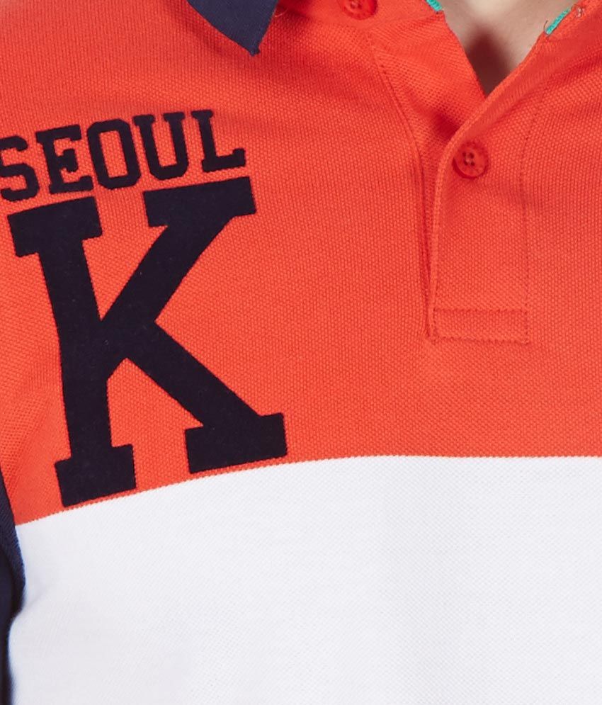 white and orange kappa shirt