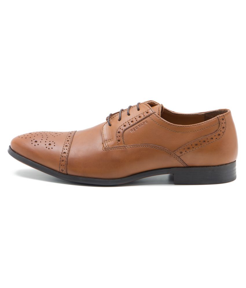 red tape tan color shoes