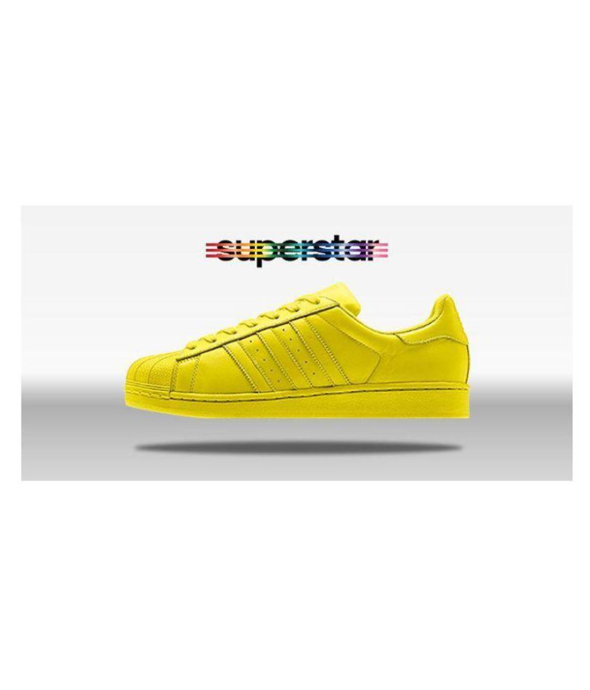 yellow adidas superstars