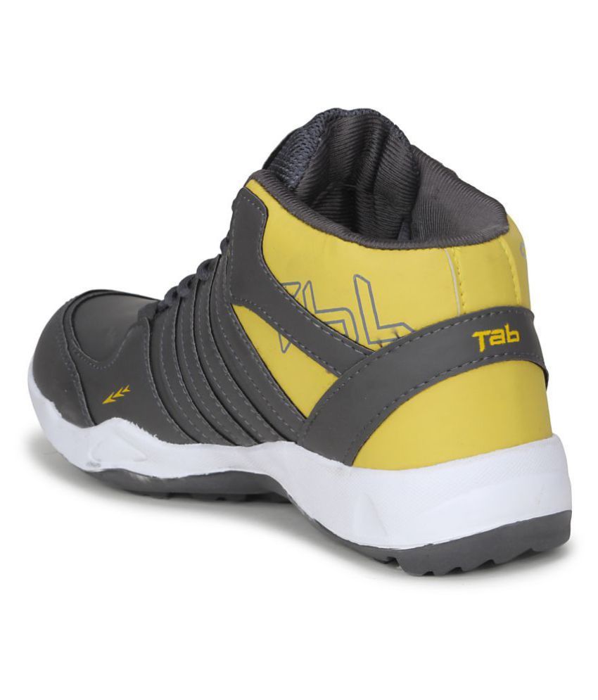 white and yellow basketball shoes