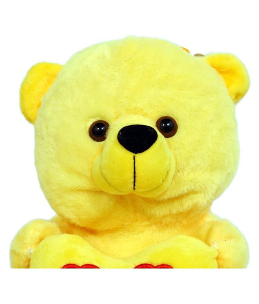 white and yellow teddy bear