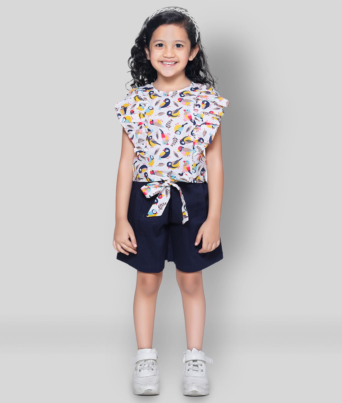     			Bird Print ruffle top with Navy belted shorts Set