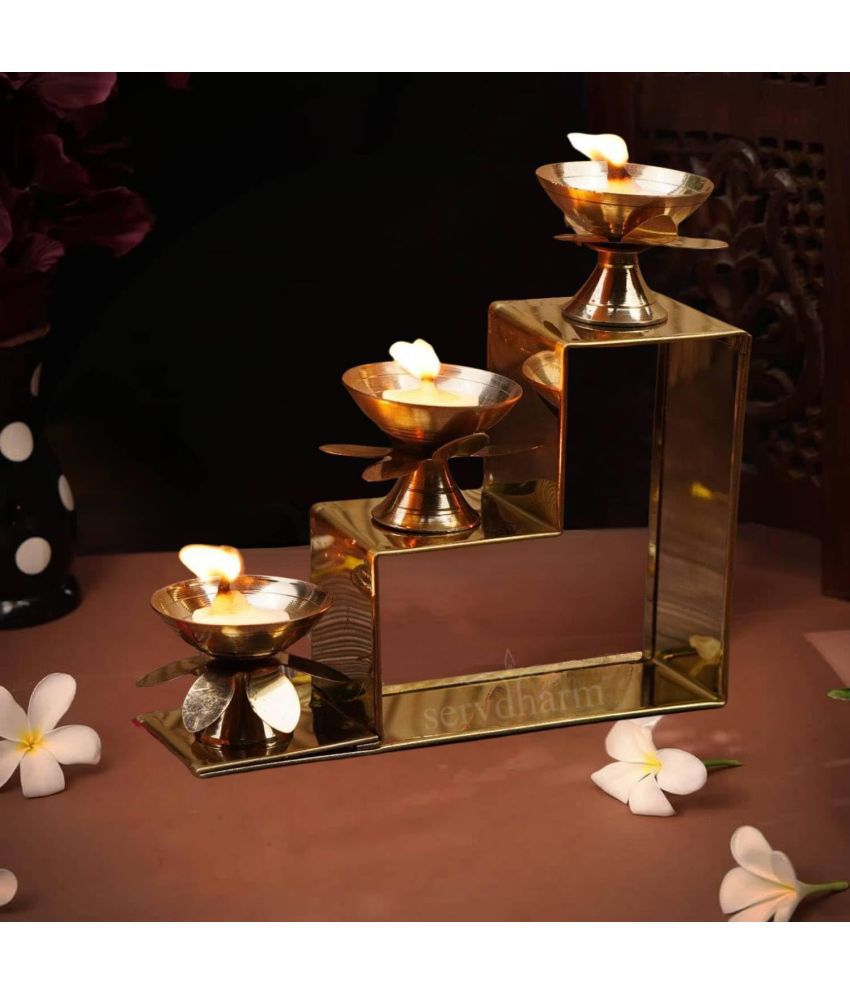     			Servdharm 3 Step Decorative Brass Table Diya for Puja - Pack of 1